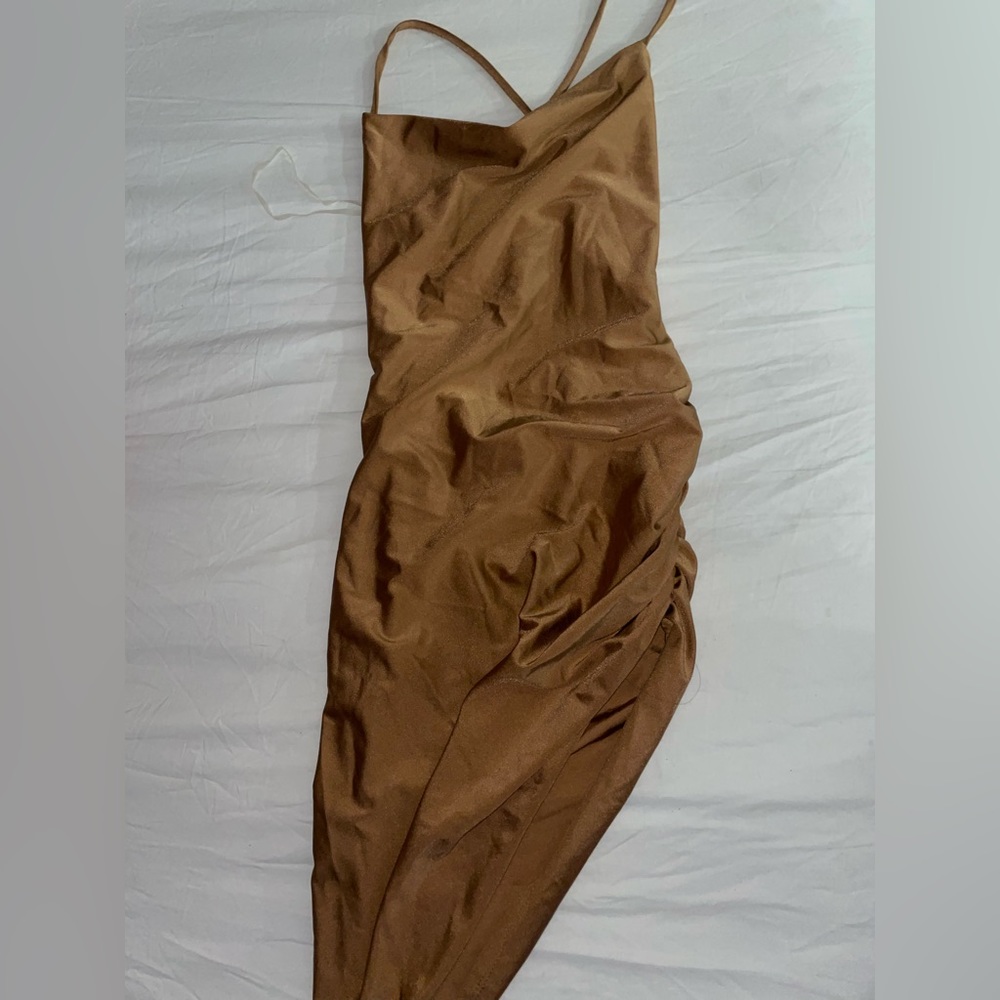 Size S Fashion Q dress with a side slit on leg an with a  cross back string
